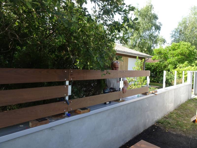 paysagiste pour la réalisation d'une clôture en lame IPE